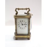 A French brass and glass carriage clock, retailed by Sorley Glasgow, with key Condition Report:winds