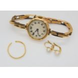 A 9ct gold cased ladies watch with a 9ct gold wrapped strap (some losses) weight including mechanism