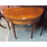 A Victorian mahogany demi lune fold over tea table on square tapering supports, 74cm high x 92cm