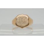 A 9ct gold shield shaped gents signet ring, size R1/2, weight 3.5gms Condition Report:Available upon