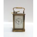 a French brass and glass carriage clock retailed by John Hall & Co Manchester Condition Report: