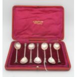 A set of six cased silver seal top spoons, with pear shaped bowls, by Thomas Bradbury & Sons,