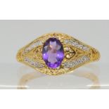 An amethyst and diamond accent ring the shank stamped 10k, size O, weight 3.3gms Condition Report: