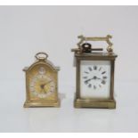 A French brass and glass carriage clock and another clock by Swiza Condition Report:Carriage clock
