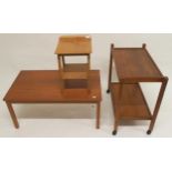 A mid 20th century teak coffee table, teak two tier tea trolley and a laminated top stool (3)