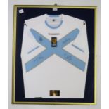 MUSIC/SPORTING MEMORABILIA A framed 2007-08 Scotland away football shirt, signed by the members of