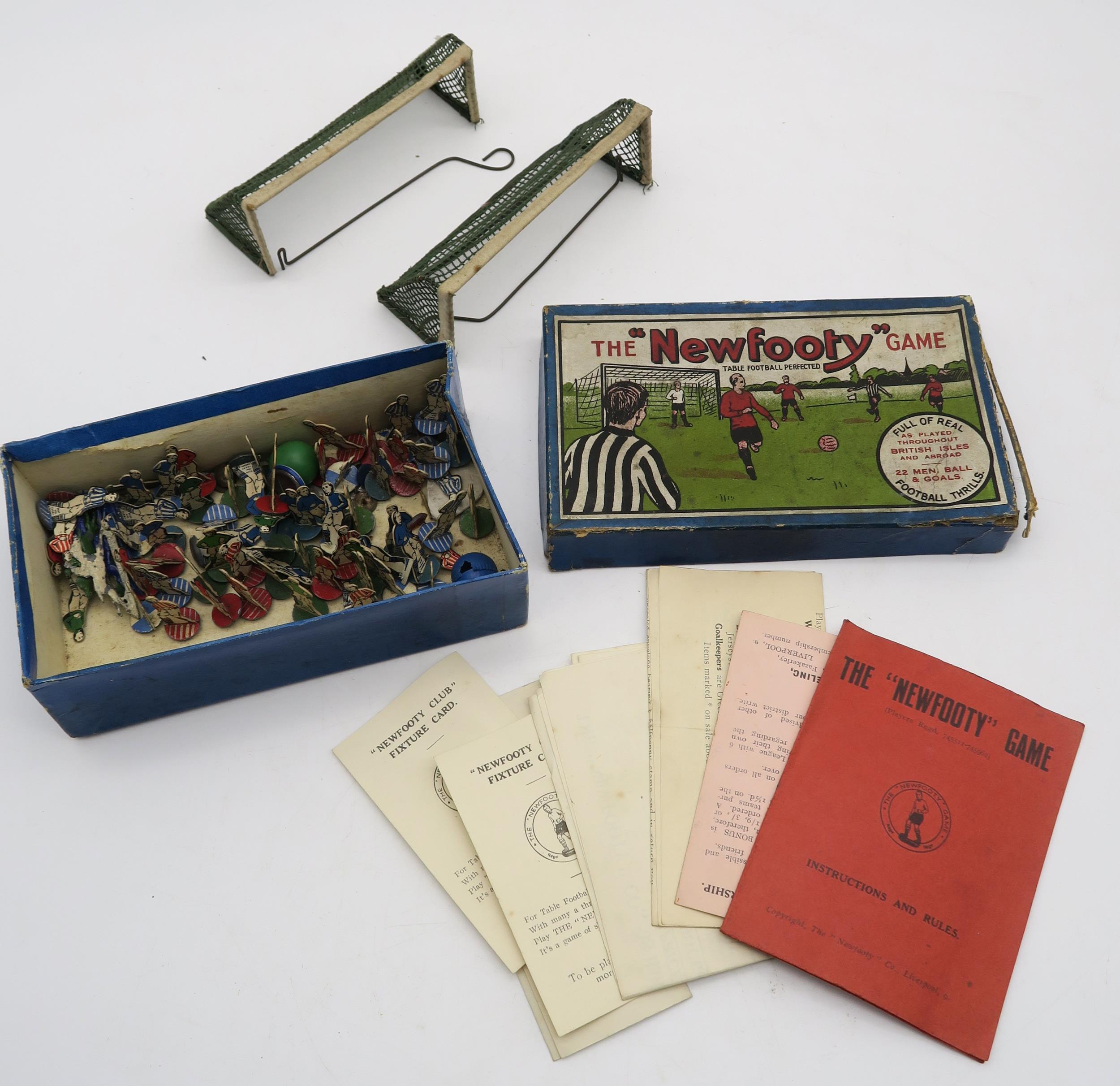 A boxed "Newfooty" table football set, with players, goals and instructions Condition Report: