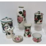 A collection of Wemyss pottery including a plum pattern biscuit barrel, a cabbage rose painted vase,