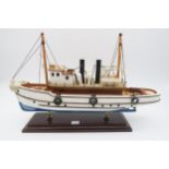 A wooden steamboat model Condition Report:Available upon request