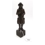 A Black Forest carved figured of a man in continental country dress  Condition Report:Available upon