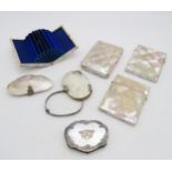 A collection of mother of pearl items, comprising two card cases, two white metal-mounted concertina