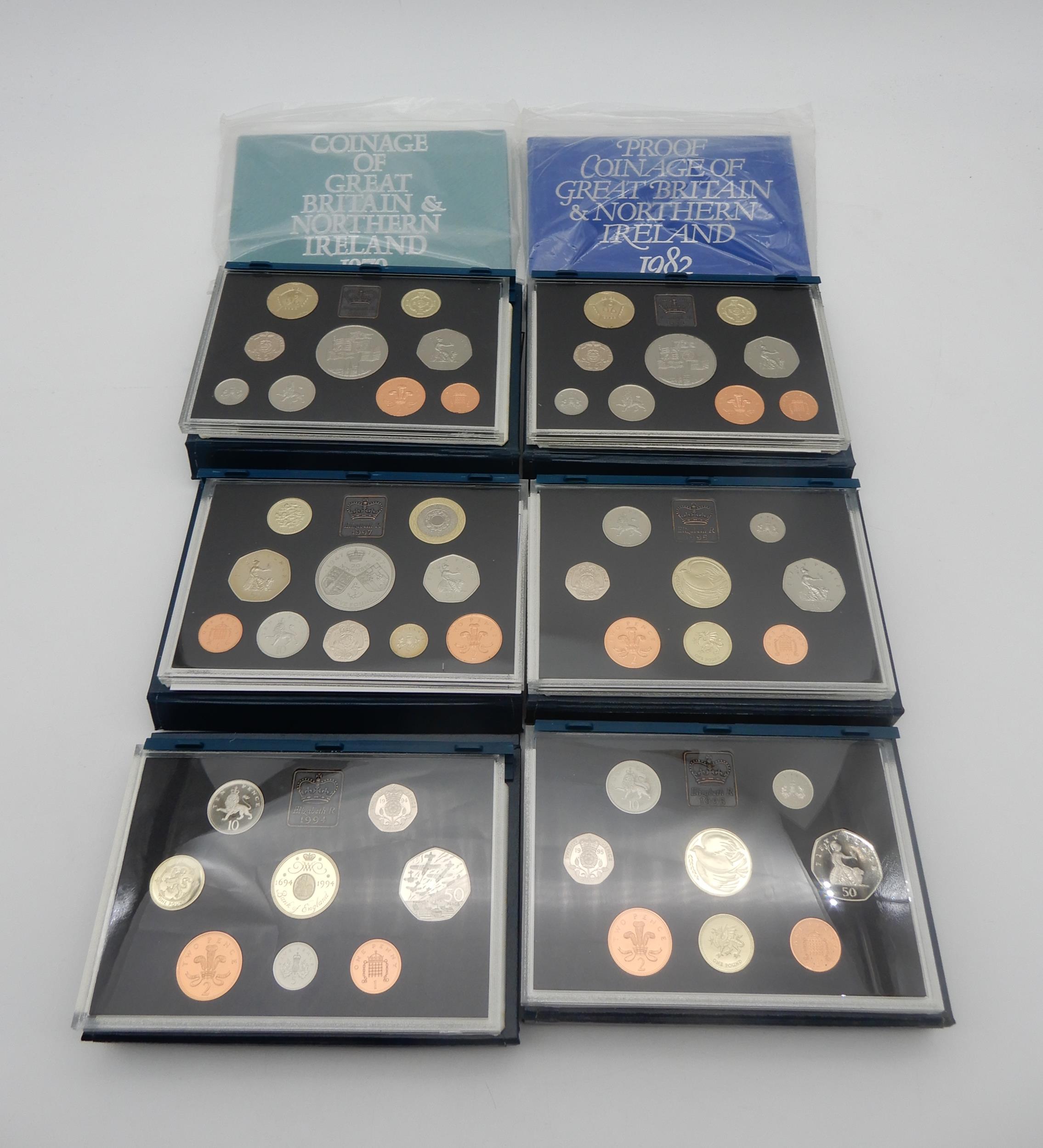 ROYAL MINT proof coin sets with examples through the 1990's together with 1979 and 1982 Condition