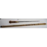 A bamboo sword-stick, the scabbard carved with stylised mushrooms Condition Report:Available upon