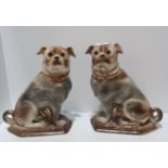 A pair of Bo'Ness pottery pug dogs Condition Report:Available upon request