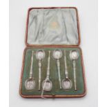 A cased set of silver coffee spoons modelled after the anointing spoons, Chester 1901, in an