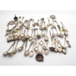 A large collection of silver flatware, comprising mainly silver teaspoons, including a silver