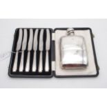 An Edwardian silver hip flask, by G & J W Hawksley, Sheffield 1902, and a set of silver handled