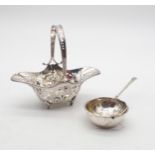 An Edwardian silver sugar basket, the body and handle with pierced Art Nouveau decoration, by