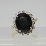 A 9ct gold sapphire and diamond accent cluster ring, size J1/2, weight 3.2gms  Condition Report: