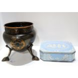 A Huntley and Palmers Wedgwood biscuit tin, together with a patinated hammered copper jardinière,