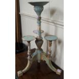 A 20th century painted quadruple torchiere stand with central pedestal flanked by three shorter