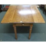 A 20th century pine single drawer Pembroke table with drop sides on turned supports, 77cm high x
