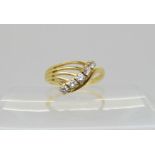 An 18ct gold five stone diamond dress ring, set with estimated approx 0.35cts of brilliant cut