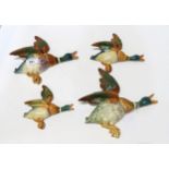 A set of four Beswick flying ducks, no's 596-2 x 2, 3 and 4 Condition Report:no 3 intact. All others