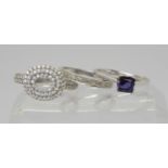 An 18ct white gold amethyst ring, size L1/2, weight 2.7gms, and two 9ct white gold rings, a cz