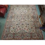 A cream ground Tabriz floral design rug with floral borders, 306cm long x 217cm wide Condition