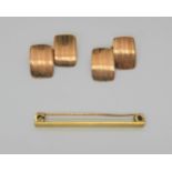 A pair of 9ct rose gold cufflinks, weight 5.9gms, together with a 15ct gold tie pin weight 3gms