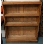 A 20th century light oak open bookcase with three adjustable shelves, 114cm high x 87cm wide x