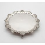 An Edwardian silver card tray, the body engraved '26th March 1965, with scroll and shellwork rim, on