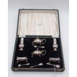 An Elizabeth II cased silver cruet set, comprising two casters, two mustard pots, two salts, with