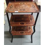 A 19th century continental marquetry inlaid three tier occasional table with brass gallery top on