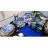 A large collection of blue and white transfer printed ceramics including plates, jugs, vases etc