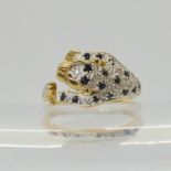 A 9ct gold sapphire and diamond,  leopard shaped ring, size L1/2, weight 2.9gms Condition Report: