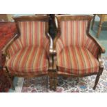 A pair of 20th century oak framed tub chairs with striped upholstery (2) Condition Report: