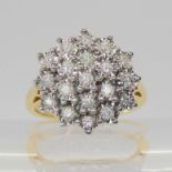 An 18ct gold illusion set diamond cluster ring, set with estimated approx 0.30cts of brilliant cut