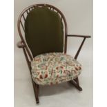 A mid 20th century elm and beech Ercol rail back rocking chair, 91cm high x 75cm wide x 80cm deep