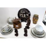 A carved wooden figural tobacco pot, three carved wooden figures, Japanese eggshell teaset, and