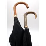 A 9ct gold-mounted gentleman's umbrella with curved horn handle, the band engraved "To Mr.