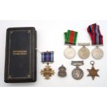 A collection of WW2 medals and badges, comprising a General Service Medal with Palestine clasp (