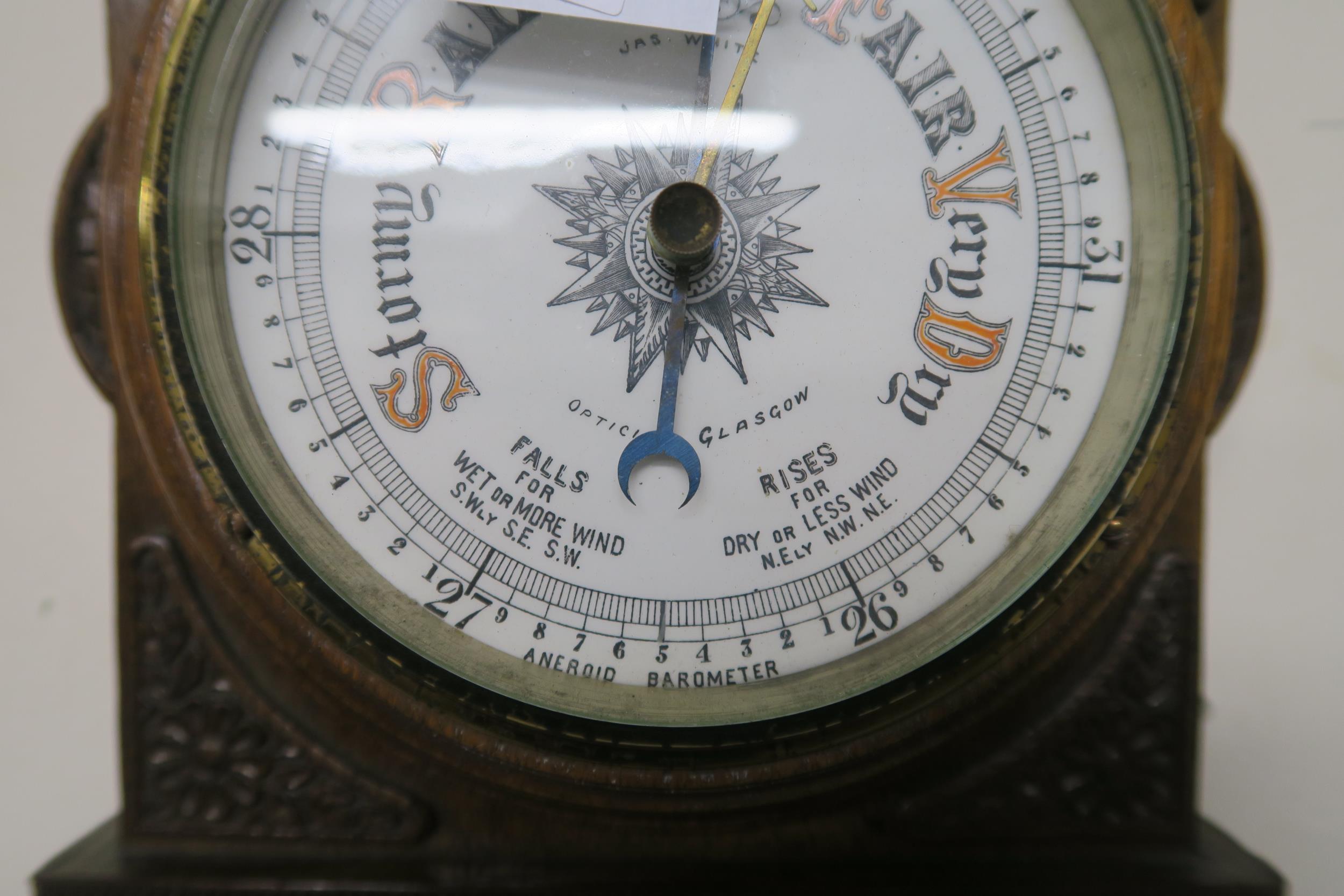 A 20th century carved oak barometer/thermometer and brass framed circular wall mirror (2) - Image 4 of 8