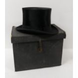 A silk top hat, small size, in original box Condition Report:Available upon request