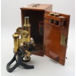 A cased microscope by J. Swift & Son, London, with two spare lenses and three brass lens cases