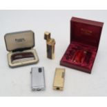 A Christian Dior cigarette lighter, together with four other various lighters, mainly Ronson