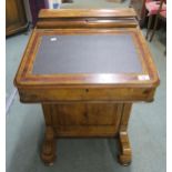 A Victorian walnut and burr walnut inlaid Davenport writing desk with hinged top stationary