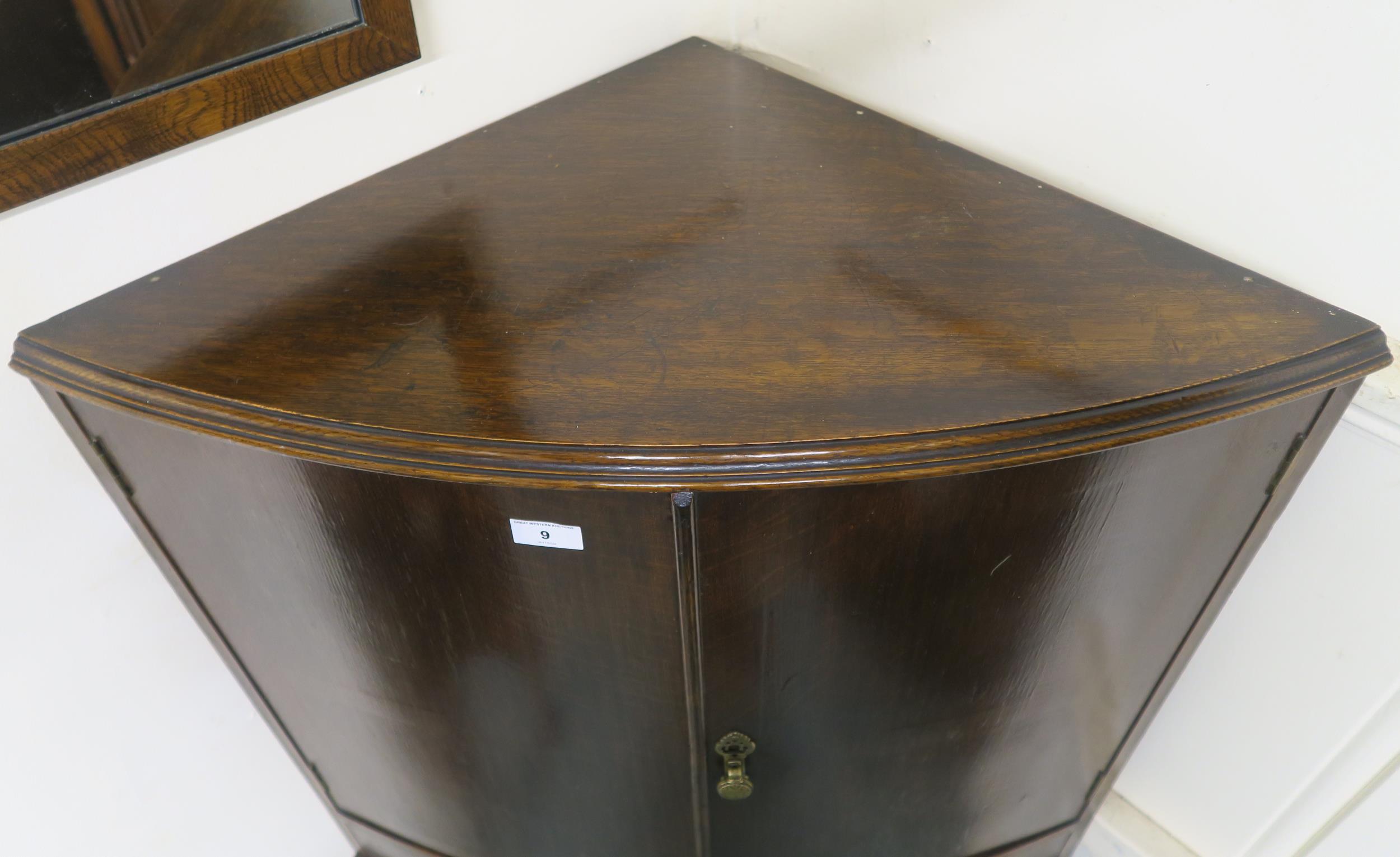 An early 20th century oak bow fronted corner cabinet, 146cm high x 78cm wide x 48cm deep Condition - Image 5 of 5