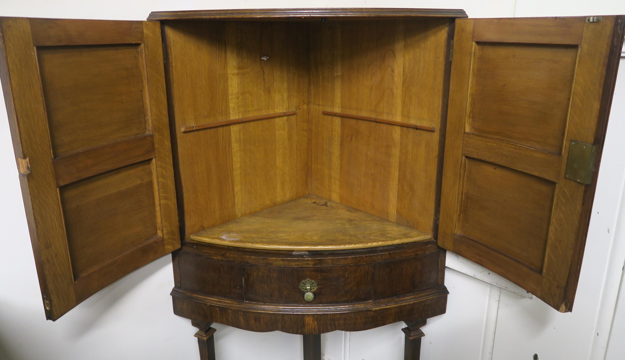 An early 20th century oak bow fronted corner cabinet, 146cm high x 78cm wide x 48cm deep Condition - Image 2 of 5